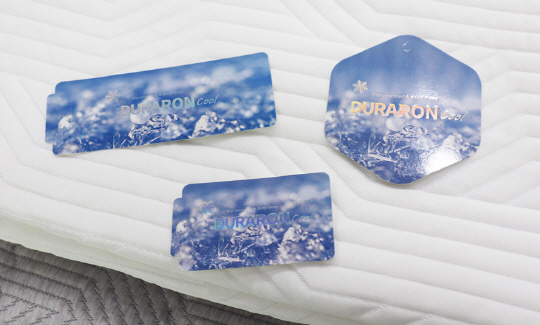 휴비스의 듀라론-쿨의 신규 정품 인증택 3종. 휴비스 제공.